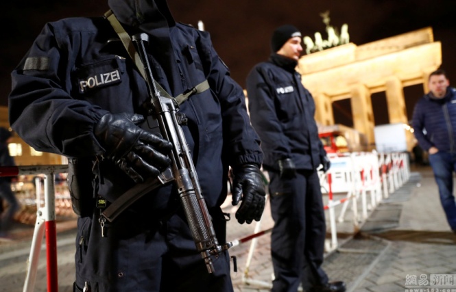 Germany police stationed at the Brandenburg Gate to ensure security during the new year